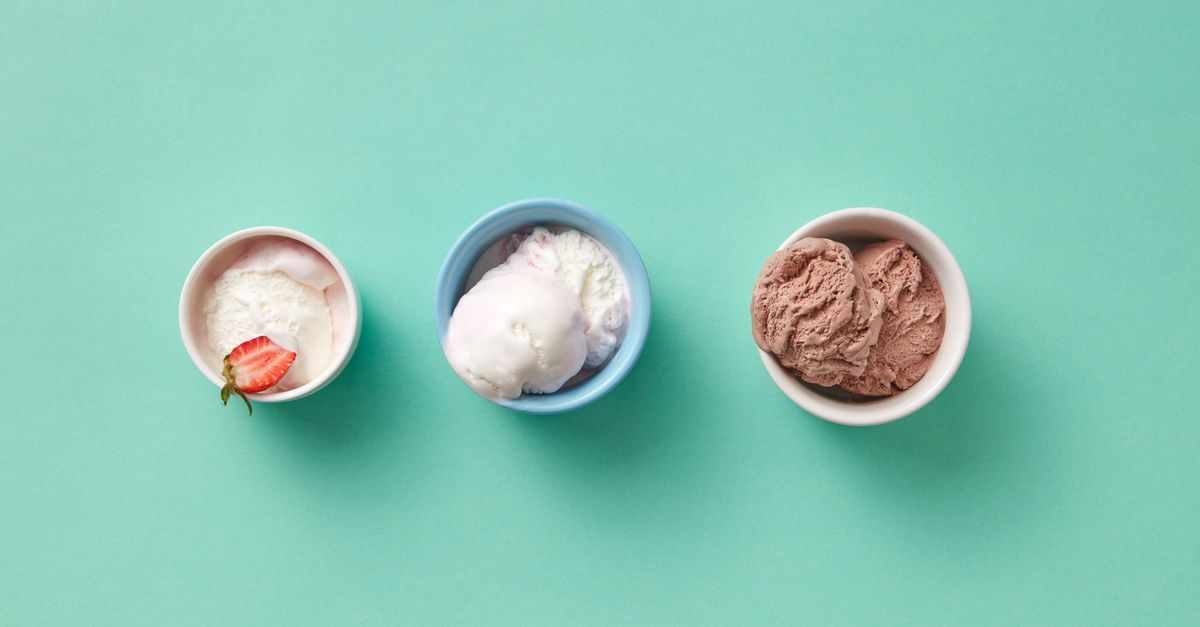 Three different ice cream flavors in cups on a mint green background. Perfect for dessert themes.